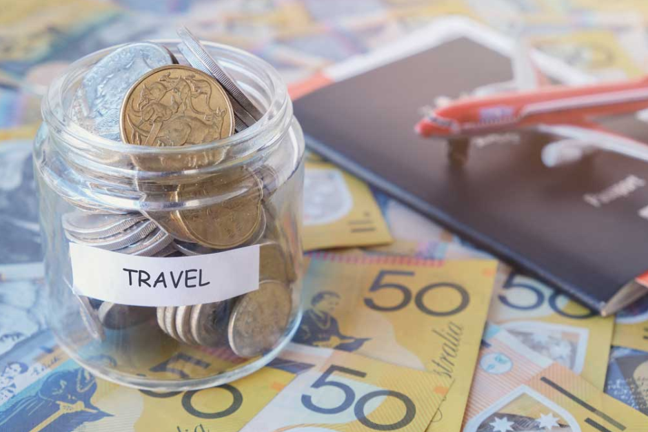 travel jar with coins and passport